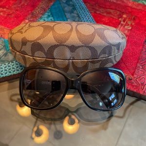 Coach sunglasses with original case .  Gray lenses.